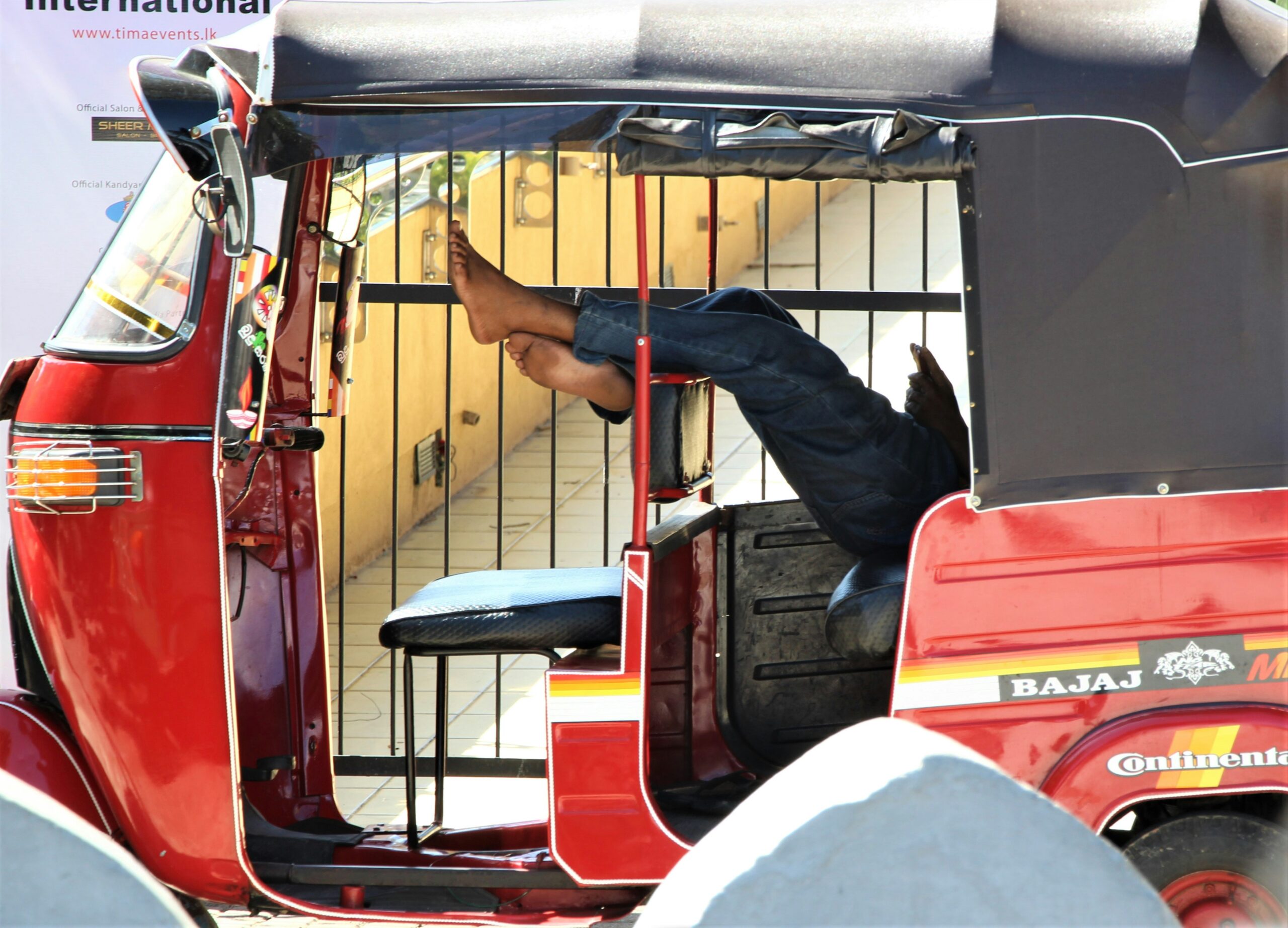 red vehicle close up photography